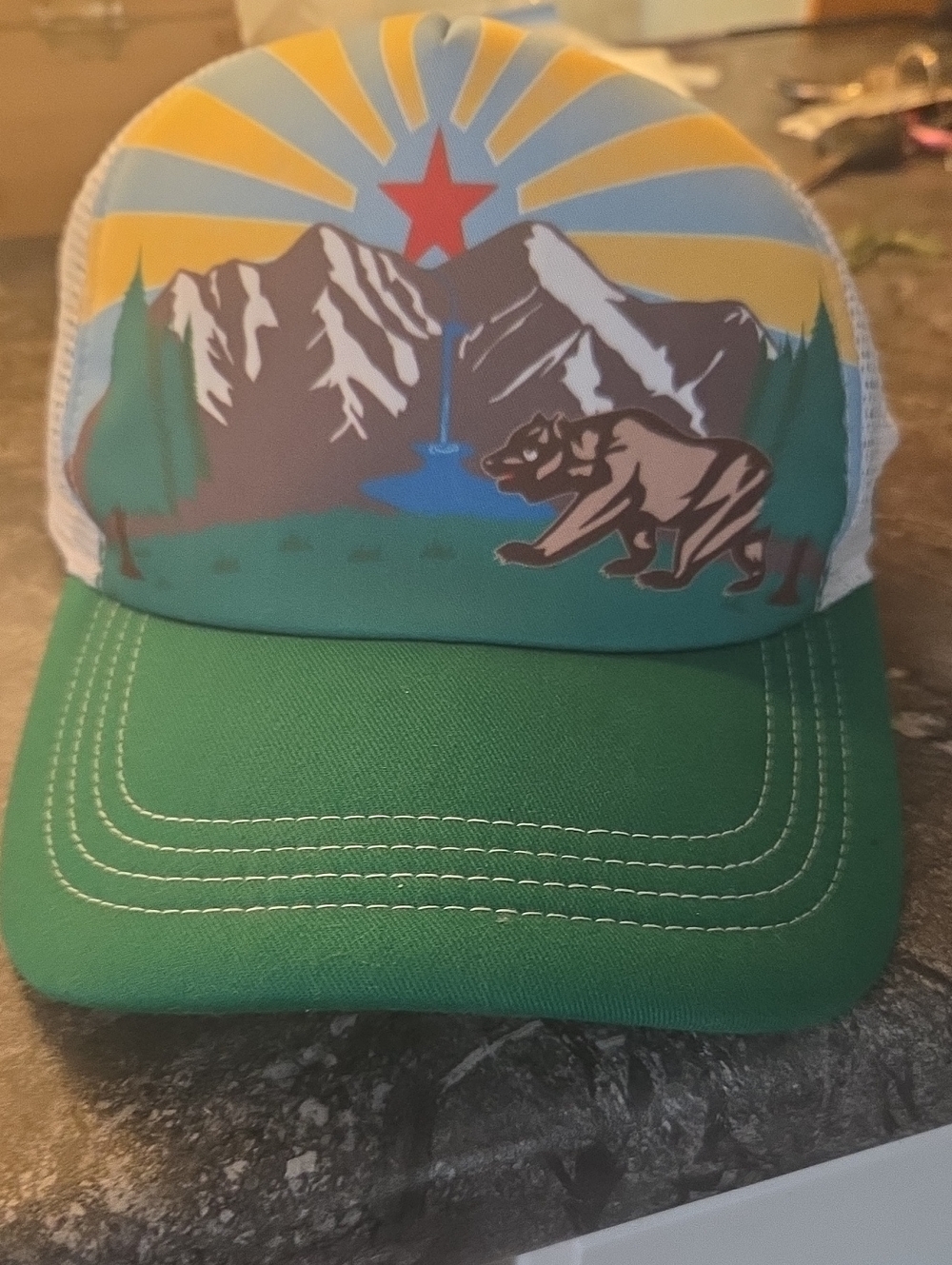 Green Trucker Hat with Mountain, Bear & Sunrise Graphic